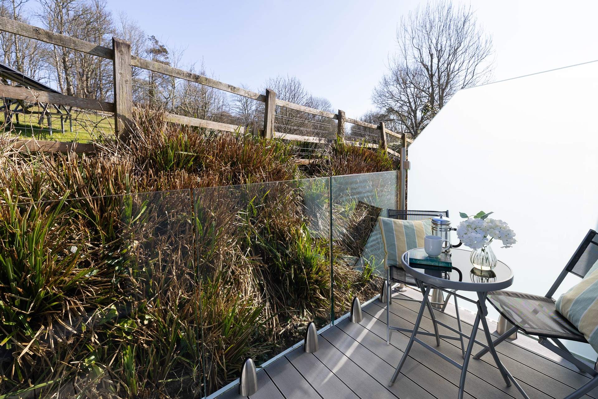 Enjoy a refreshing drink on the private balcony. 