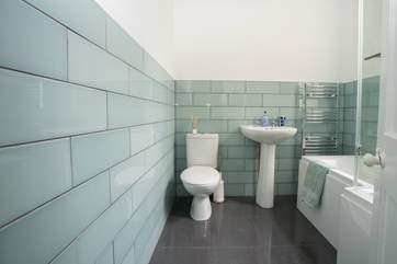 Relax and enjoy a soak in the modern bathroom.