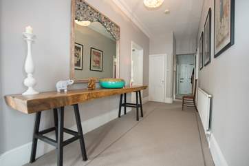 The large entrance hall accommodates more stunning furniture, with high ceilings and natural light, this is just the welcome you would expect.