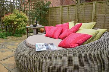 The patio has outside garden furniture for al fresco dining and this beautiful seating is perfect for relaxing in the sunshine.