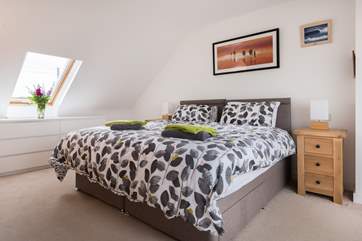 This is Bedroom 3, located on the first floor, and you have the choice of twin beds or a super-king! You also have a choice of rural and sea views from this bright and crisp room.