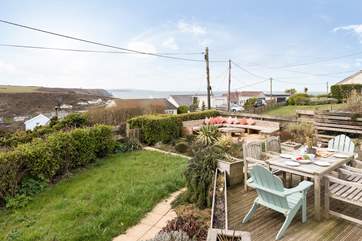 This is the rear garden at Sun View. With a corner area for chatting, and a seating-area to enjoy al fresco dining.