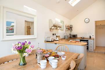 The kitchen/dining-room is wonderfully light and airy.