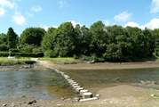 At low tide you can walk across the river via the stepping stones.