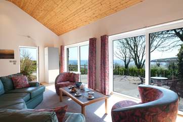 The sitting-area has double patio doors so the stunning view can be enjoyed all the year round.