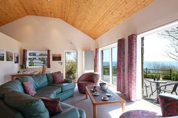 Enjoy lazing on the comfy sofa listening to the sound of the sea in the background.