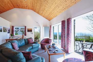 Enjoy lazing on the comfy sofa listening to the sound of the sea in the background.