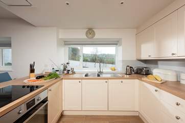 The kitchen has wonderful views across open fields.