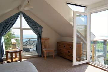 There are two ways onto the roof terrace from this spacious bedroom with wonderful views.
