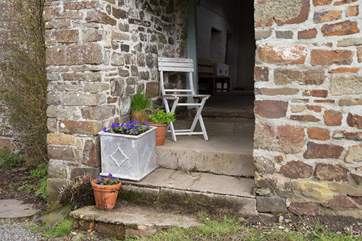 Steps from the covered area take you down into the garden.