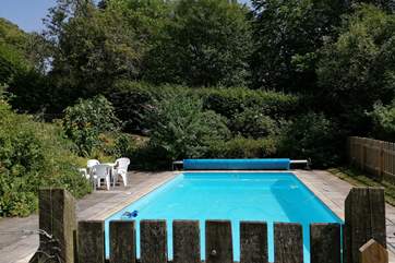 The swimming pool is in a fenced area in the lower gardens of Affeton Castle.