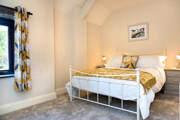 Bedroom 3 has a pretty bedstead.
