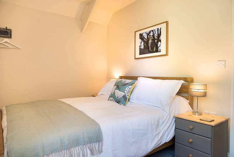 Bedroom 2 is decorated in restful tones.