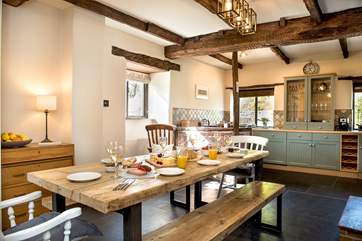 Gather together for holiday meals around the fabulous industrial-style dining-table.