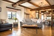 The open beams and wooden floors add to the overall character and charm.
