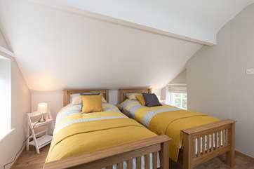 Another view of the dual-aspect twin bedroom.