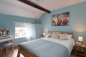This is the double bedroom, peaceful and calm and with its outlook to the front of the cottage.