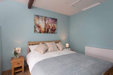 As with the master bedroom the high ceiling creates a feeling of space and light.