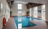 If the outdoor pool doesn't tickle your fancy, this large indoor heated pool is also available. - Thumbnail Image