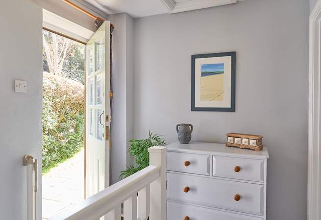 Both bedrooms sit off of the landing, the back door opens up on to the complex. 
