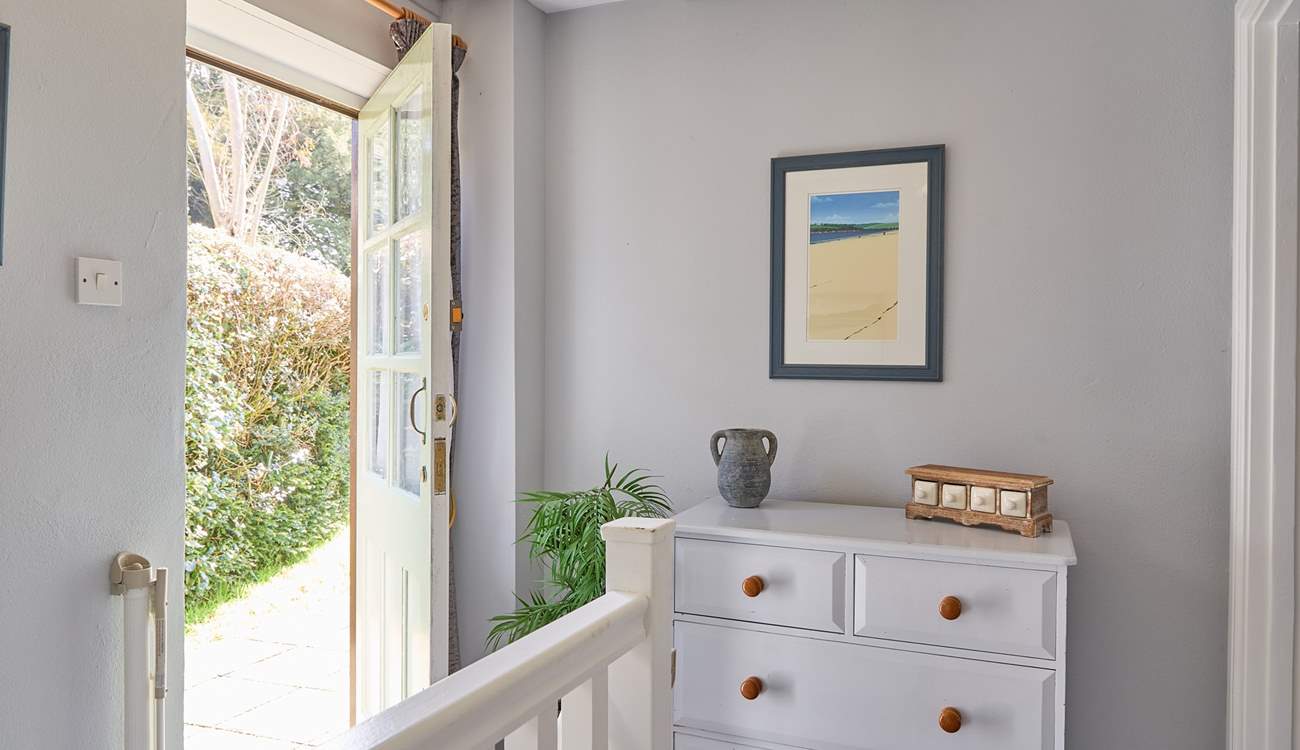 Both bedrooms sit off of the landing, the back door opens up on to the complex. 