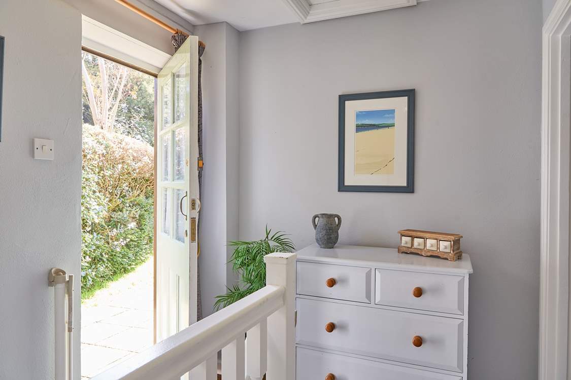 Both bedrooms sit off of the landing, the back door opens up on to the complex.