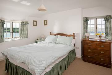 This light bedroom has views both up and down the creek (Bedooom 2).
