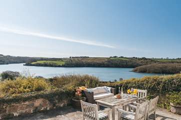 The sunny terrace makes the most of the stunning outlook.
