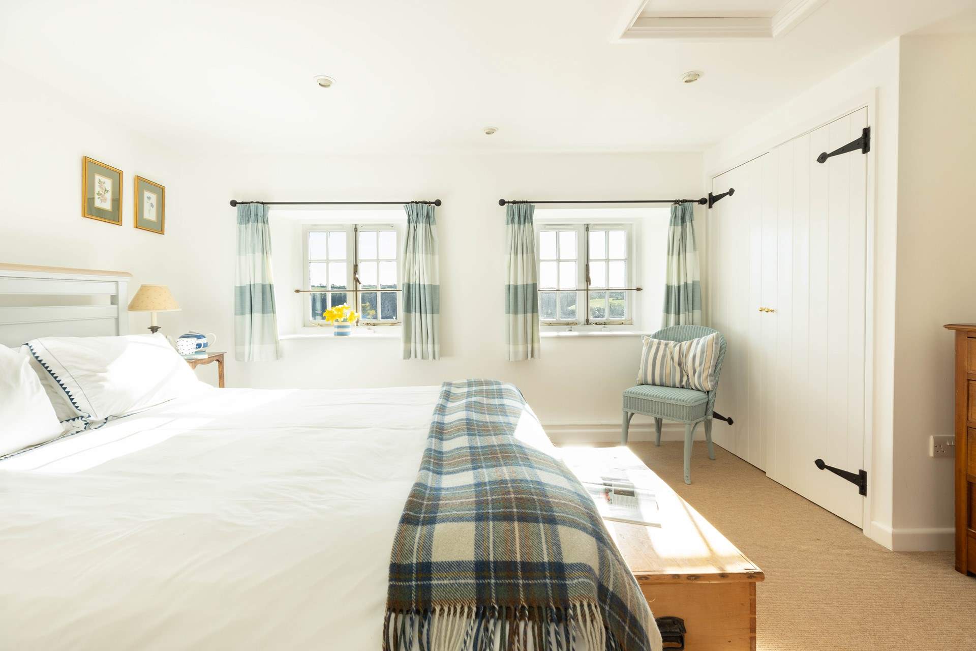 The main bedroom is decorated in calming hues. 