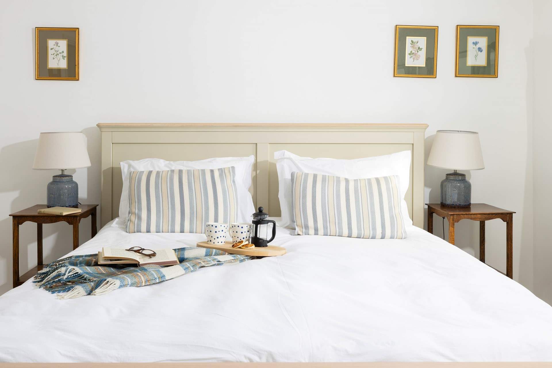 Crisp white linens await your slumber. 
