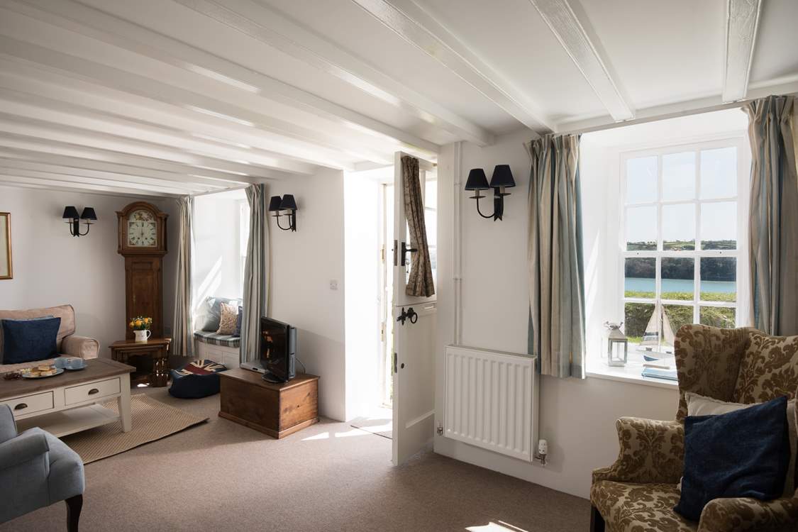 The sitting-room has a stable-door that opens towards the private lane.