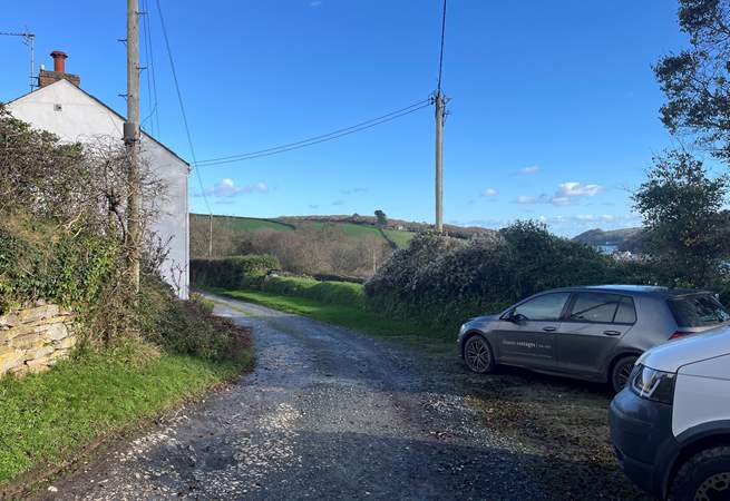The drive leading to Creek Cottage, with the cottage on your left an car parking space on your right. 