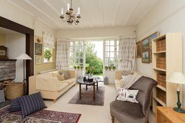 The sitting-room has a calm and tranquil feel, in fact the whole house does. French windows lead to the terrace at the front of the house.