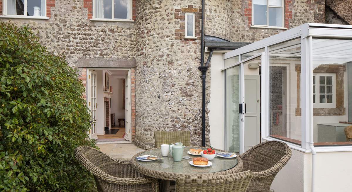 This beautiful listed cottage has a turning staircase, hidden within the curved stone feature seen at the back of the cottage.