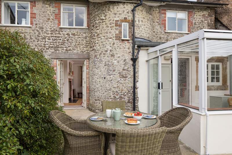 This beautiful listed cottage has a turning staircase, hidden within the curved stone feature seen at the back of the cottage.