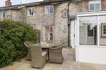 The south-west facing garden is a real sun-trap and fully enclosed to keep your children and dog safe. The lawned-area is behind.