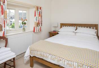 This pretty bedroom has a 5ft bed and looks out over the square.