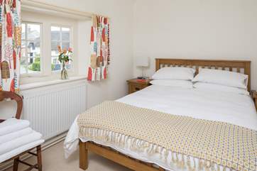 This pretty bedroom has a 5ft bed and looks out over the square.