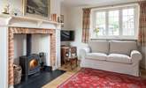 The sitting-room has a cosy wood-burner for chilly evenings. - Thumbnail Image