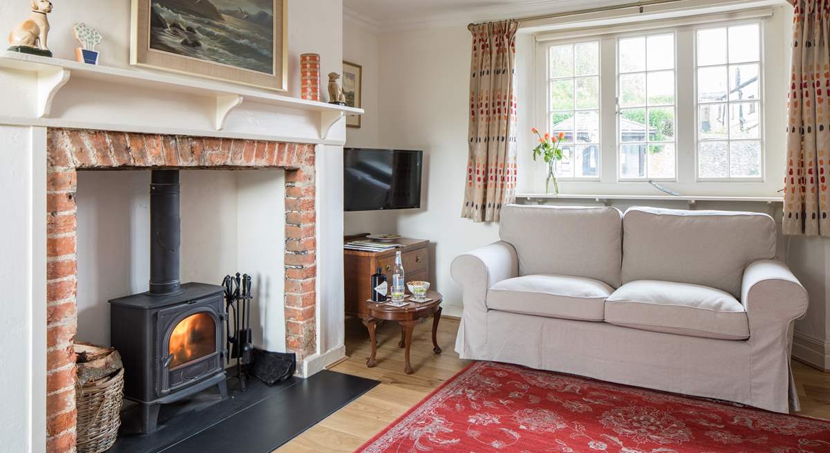 The sitting-room has a cosy wood-burner for chilly evenings.