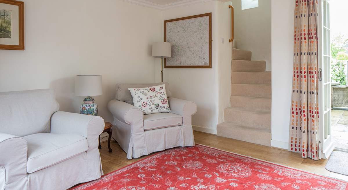 The beautiful spiral staircase leads from the sitting-room.