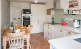 The bespoke kitchen/dining-room with an induction hob. - Thumbnail Image