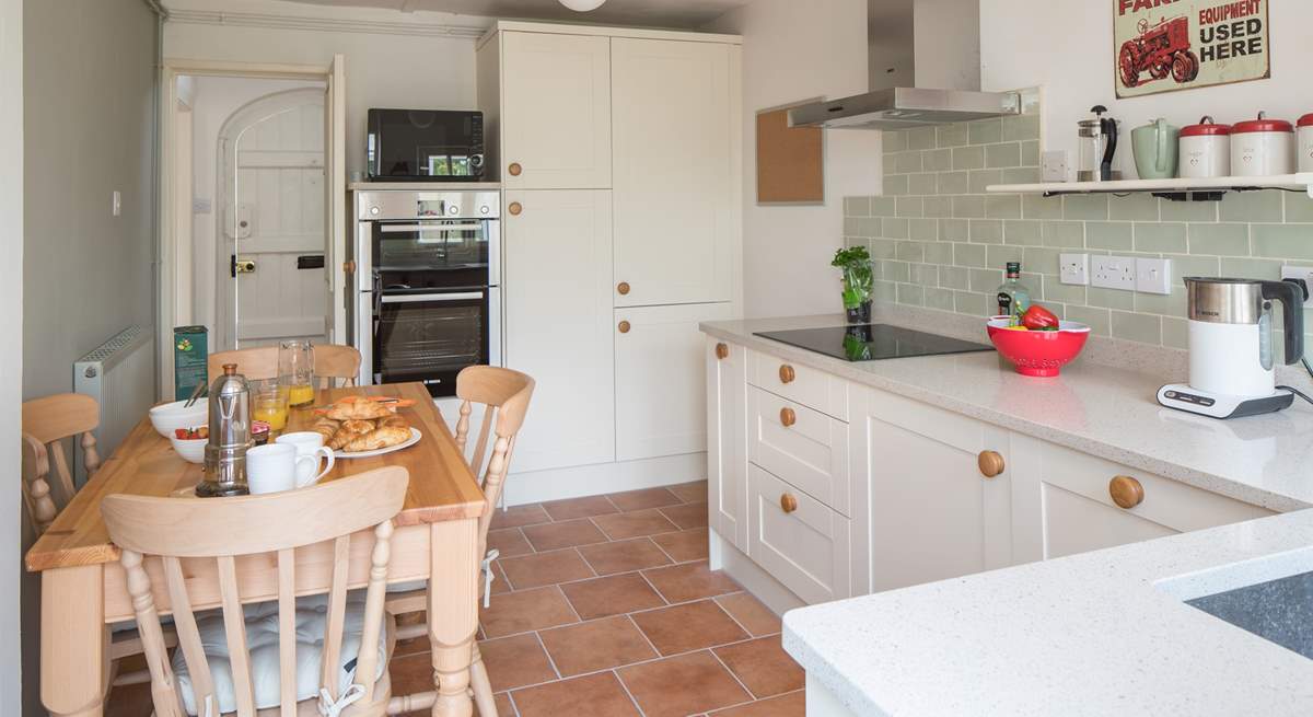 The bespoke kitchen/dining-room with an induction hob.