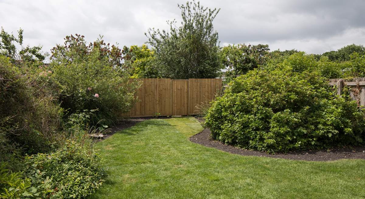 The garden is fully enclosed to keep little ones and dogs safe. Please note this high fence has been replaced with a picket fence and gate.