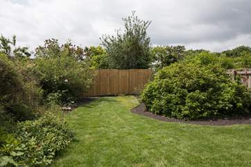 The garden is fully enclosed to keep little ones and dogs safe.