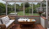 The conservatory looks out over the enclosed south-west facing garden. - Thumbnail Image