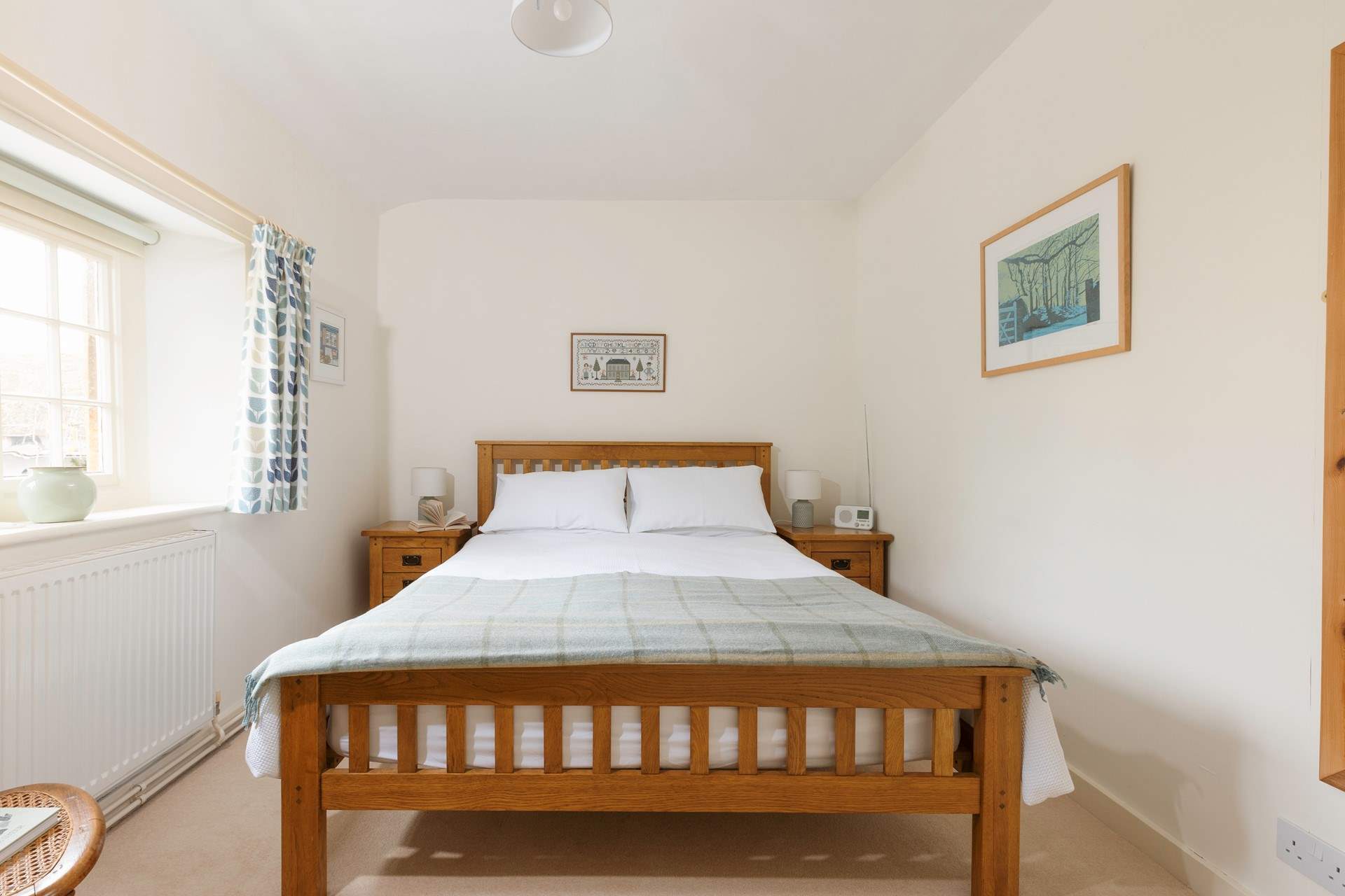 This pretty bedroom has a king-size bed and looks out over the square.