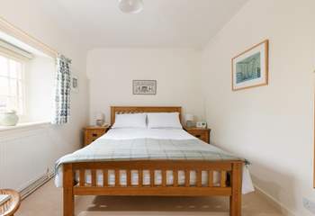 This pretty bedroom has a king-size bed and looks out over the square.