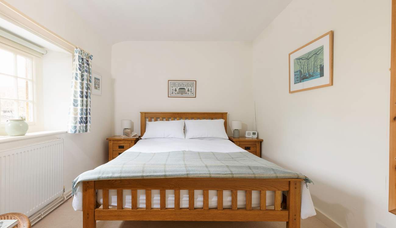 This pretty bedroom has a king-size bed and looks out over the square.