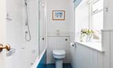 A bath and shower in this bright family bathroom. - Thumbnail Image